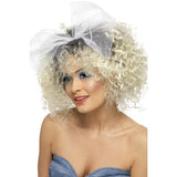 1980s Wild child wig, short, curly, blonde with dark roots and white mesh bow attached.