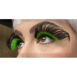 Dramatic green and black eyelashes are large with high impact.