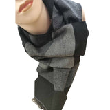 Close-up of the deluxe grey and black stripe scarf wrapped around the neck of a mannequin, showcasing its texture and finished edges, against a white background