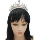Crystal Princess Tiara in silver, adorned with rhinestone detailing, worn on a mannequin with a black wig, against a white background