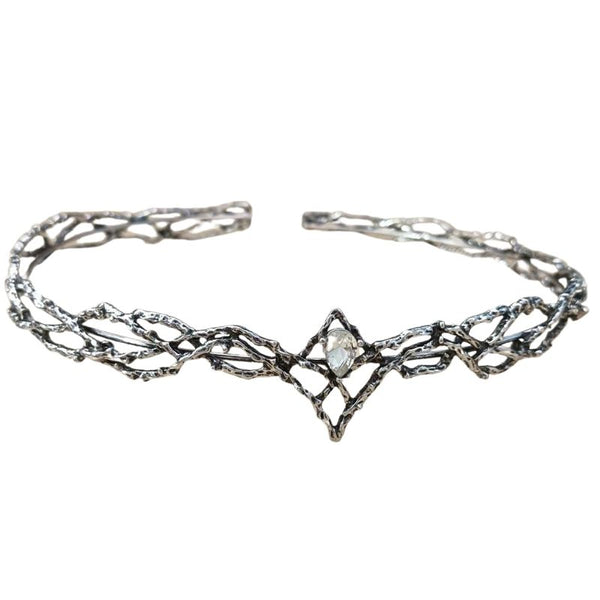 Elven medieval fantasy crown crafted from metal with intricate textures, a silver finish, and a central gem at the front, shown from the front view on a white background