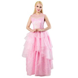Lady with blonde hair, wearing the Glinda Wicked costume, standing with hands on her stomach and looking up. The costume includes a shimmering pink bodice, and a cascading tulle skirt against a white background
