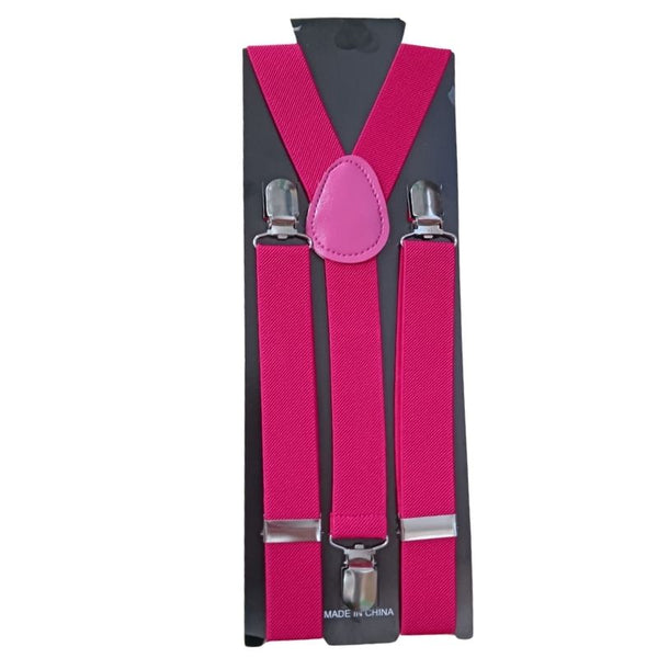 Pink clip-on suspenders attached to cardboard packaging, featuring adjustable straps and metal clips.