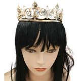 Mannequin head with a black wig wearing a gold crown featuring fleur-de-lis shapes and clear gems, elegant and regal in design