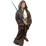 Person wearing the Space Knight costume, posing with a blue and silver lightsaber. The costume includes a wrap-around tunic, pants with elastic waistband, boot tops, belts, and a brown robe, against a white background