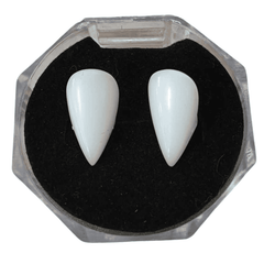 Set of two vampire teeth caps, accompanied by thermal fitting beads and small tweezers for customization, against a white background
