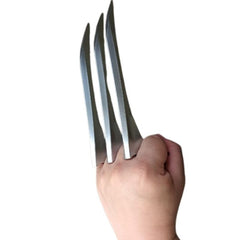 Wolverine-style claw accessory held in a clenched fist, featuring three silver metal-look blades protruding from the knuckles for a fierce, battle-ready appearance.