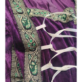 close up of trim and lace up detail on purple velvet dress