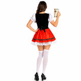 A woman shown from the back wearing a traditional German dirndl costume, featuring a black velvet bodice, white puffed sleeves, and a red skirt with white lace trim. She is holding a beer mug against a solid white background.