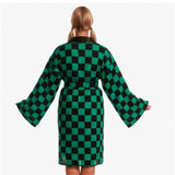 Rear view of anime demon kimono costume showing green and black check design