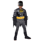 Child wearing an officially licensed Batman Premium costume with muscle chest, cape and mask