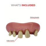Dental prosthesis with fake teeth and fitting beads on a white background