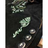 Close up of buttons and embroidery on black leather lederhosen