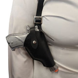 Black holster with a prop gun attached to shoulder holster straps on a white background