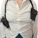 Person wearing a white shirt with black holsters on a white background