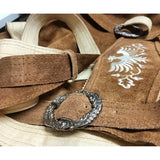 brown leather lederhosen showing buckle and close up of design of braces