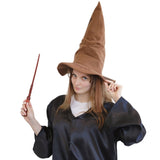 A woman wearing a brown pointed wizard hat and a black robe, holding a wand against a plain white background.