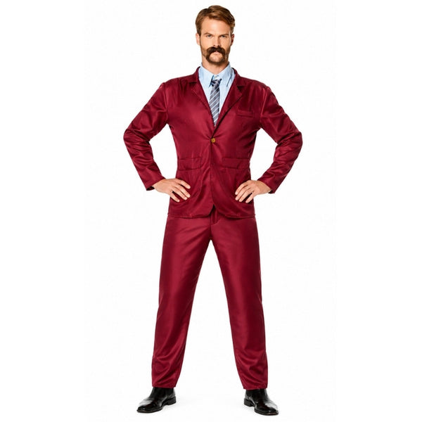 Adult wearing burgundy newsreader suit with tie and retro 70s television presenter styling