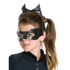 Child wearing an officially licensed Catwoman Classic costume with black jumpsuit, cat ears and eye mask