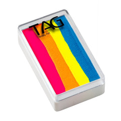 A rectangular paint palette with four vertical stripes of bright neon pink, orange, yellow, and blue paint, enclosed in a clear plastic frame.