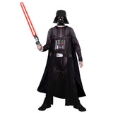 Adult wearing the Darth Vader costume with cape and mask in a character pose