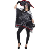Person wearing a Day of the Dead costume with black and white dress, red sombrero, and black leggings on a white background.