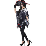 Person wearing a Halloween costume with a black and white patterned shawl, black leggings, and high heels on a white background.