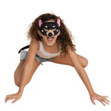 Girl wearing a Tassie Devil mask and tail