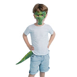 Child wearing a green dinosaur mask and tail on a white background