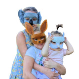 Three children wearing animal masks on a white background