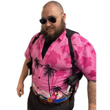 Man wearing a pink shirt with palm tree design, sunglasses, and a black shoulder holsters on a white background