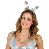 Woman wearing a silver beaded headband and necklace on a white background