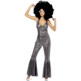 Person wearing a silver disco jumpsuit with a black afro wig on a white background