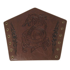 Brown leather arm cuff with intricate designs on a person's arm.