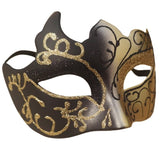 Black and gold decorative mask on a white background