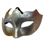 Decorative mask with gold and silver patterns on a white background