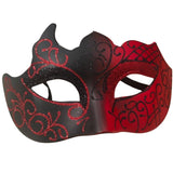 Black and red mask with intricate designs on a white background