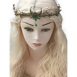 Mannequin head with blonde wig and decorative headpiece on a white background