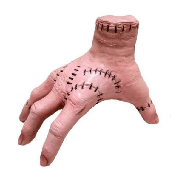 Realistic fake hand Halloween prop featuring stitched detailing, ideal for horror scenes, haunted houses, or creepy costume accessories.