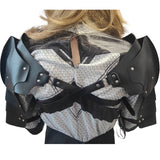 Black medieval-style shoulder armor with padded straps and silver rivets, shown on a model from the back against a white background.