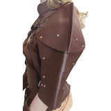A close-up side view of a brown faux-leather armor-style top or costume piece with layered shoulder plates, arm guards, and silver metal rivets, shown on a mannequin against a white background.