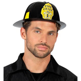 Man wearing a black and yellow fire chief hat on a white background