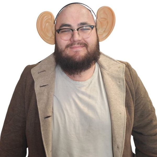 Oversized flesh-tone ears on headband for costume or giant character, front view worn