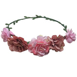 Floral headband with pink flowers on a white background