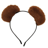 Brown furry headband with large pom-poms on a white background