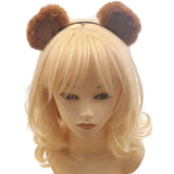 Blonde wig with brown bear ears on a mannequin head against a white background