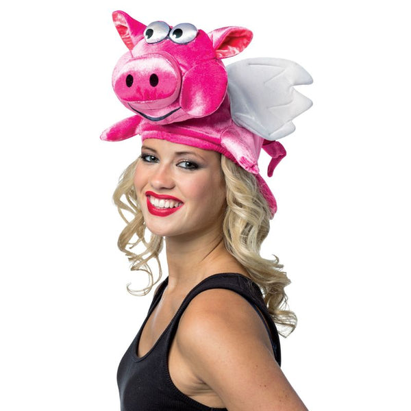 Flying Pig Hat, hot pink hat with pig face and legs hanging from the side and white wings.