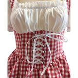Close-up of the Steffi German dirndl dress featuring a traditional red lace-up bodice and gingham fabric.