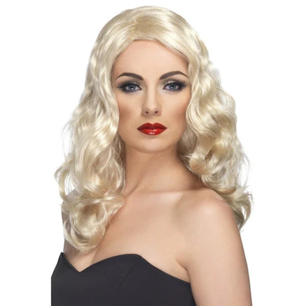 glamourous wig in blonde, side part with soft waves.

