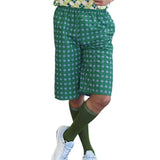 Close-up of green check shorts and green socks from golf pro costume